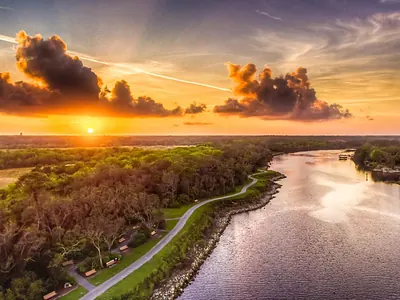 Sunset over the water and a waterside trail in Palm Coast